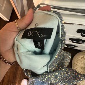 a blue sparkly prom dress, worn once